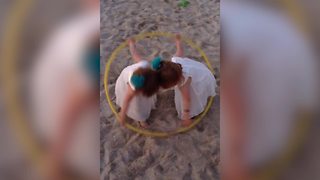 "Twin Tot Girls Dance with A Hula Hoop"