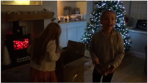 Girls unwrap surprise puppy for Christmas