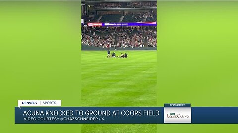 Fans run onto field and one makes contact with Atlanta Braves star Ronald Acuña Jr.