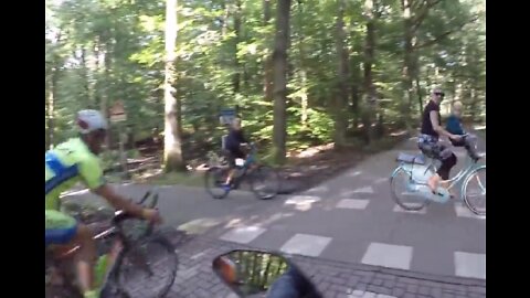 Dutch cyclists almost running over kid