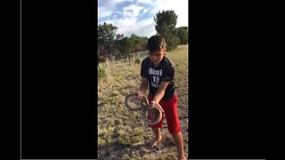 Real life Mowgli casually picks up rattlesnake