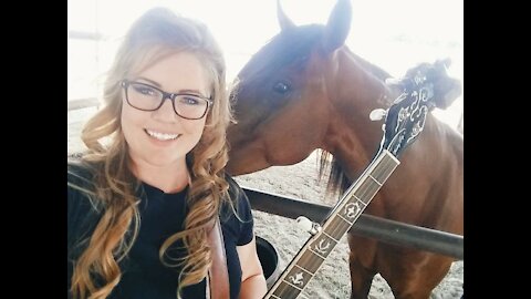 Mustang plays the banjo with his lip