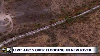 LIVE: Air15 over a flooded wash in New River Monday night