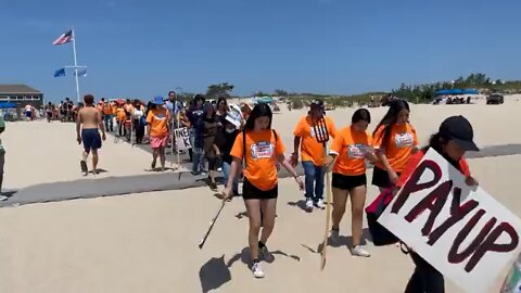 200 black & brown New Yorkers storm private beach in the Hamptons demanding taxes on billionaires