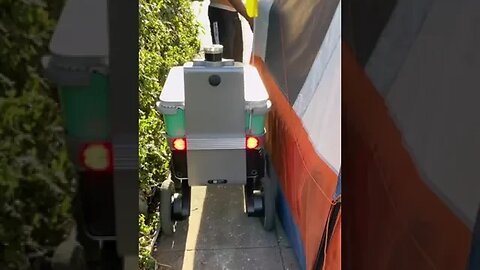 Shelby the food delivery robot having a hard time passing tents blocking the sidewalk...