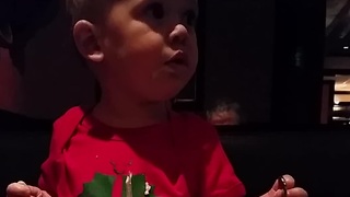 Baby confidently attempts to eat salad with fork