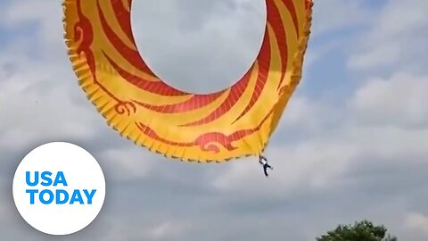 Man safe after kite lifts him high into sky at kite festival in China | USA TODAY