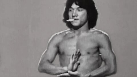 Smoking Jackie Chan choreographing behind the scenes of The 36 Crazy Fists