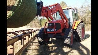 White Creek Cattle - Kubota M110x Tractor Moving Hay
