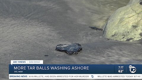 Tar balls continue to wash ashore in San Diego