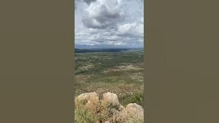 Mountain top view of a southern Arizona ghost town and river.