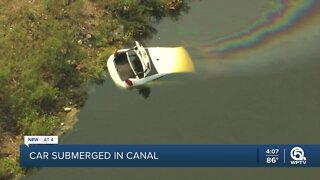 1 hospitalized after car plunges into Belle Gladecanal