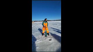 Drilling hole on ice for fishing