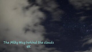 The Milky Way behind the clouds. 4K