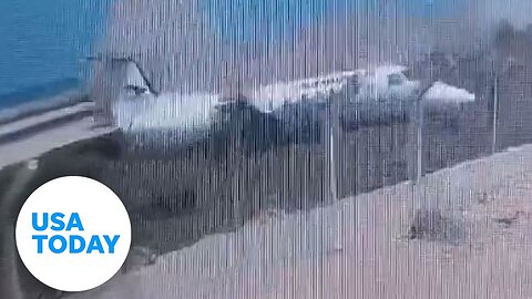 Caught on camera: Scary moment plane slides off runway, crashes | USA TODAY