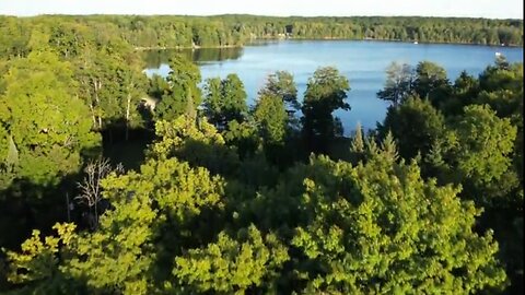 Ariel Footage of East Lake in McMillan, MI on a calm, sunny afternoon.