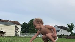 Baby falls for sprinkler trick over and over again