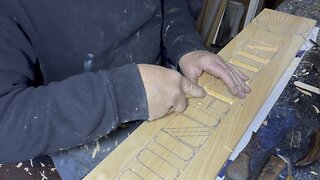 Carving letters on a custom carved Quarterboard