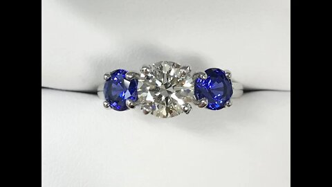 Amazing custom 3-stone ring with lab-grown diamond center and blue sapphire sides