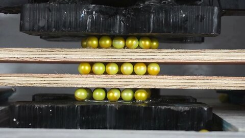 Three Layers of Paintballs Crushed In a Hydraulic Press