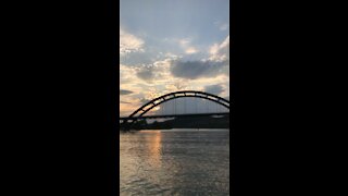 Sunset bridge by boat