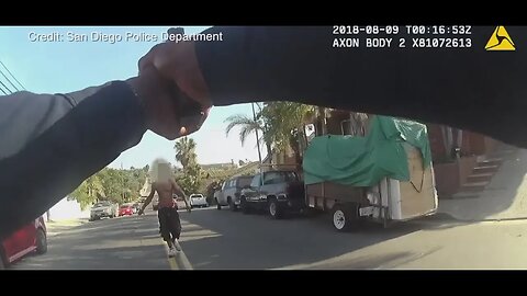Crazy man swings chain at officer, officer doesn't want to shoot