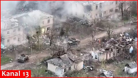 Ukrainian fighters attack with US Humvee armored vehicles houses where Russians were hiding