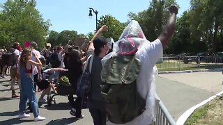 Protesters gather outside Rocket Mortgage Classic tournament