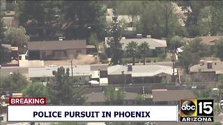 RAW: Police pursuit suspect crashes into front yard