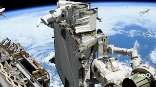 Astronauts install solar panels to space station