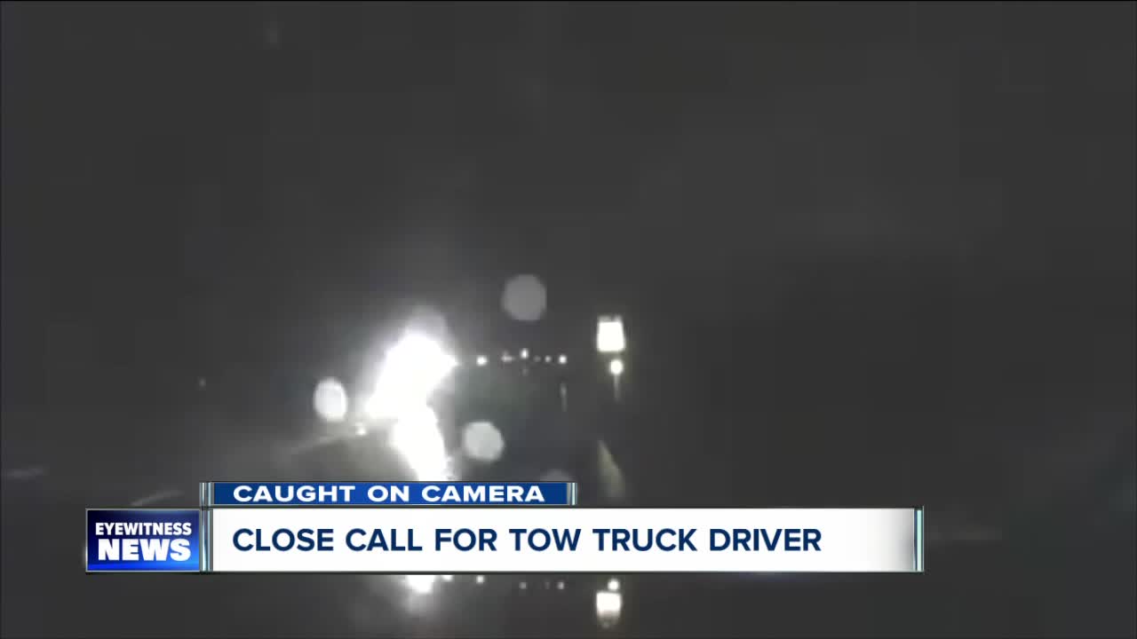 Close call for tow truck driver