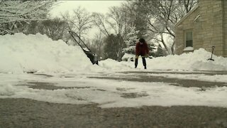 Volunteers help shovel snow for seniors after recent winter storm