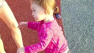 Cute Girl Gets Dizzy In A Playground