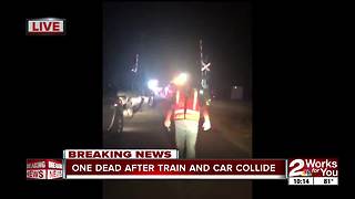 One dead after car collides with train