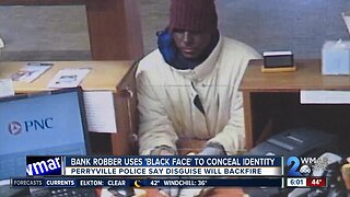 Bank robber uses 'black face' to conceal identity