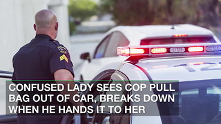 Confused Lady Sees Cop Pull Bag out of Car, Breaks down When He Hands It to Her