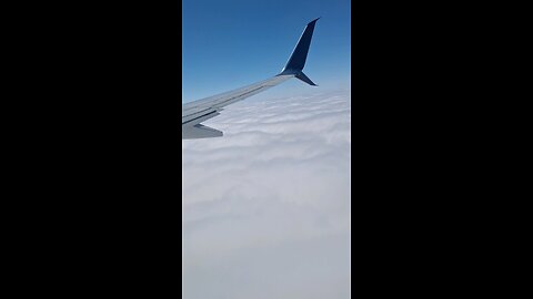 Airplane Descending Through the Clouds