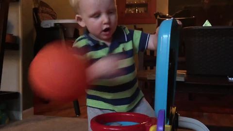 "Tot Boy Throws a Ball and Knocks Down a Camera"