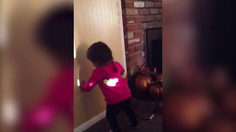 "Toddler Girl Smacks At Her Shadow"