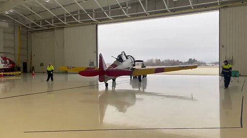 SNJ being towed into Atlantic Aviation Hangar for the Fly-in Cinema