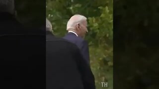 Biden's handlers help him after he gets lost