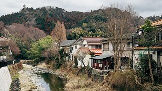 Gentle rain over a half empty river bed near Mount Takao in Takaomachi, Japan