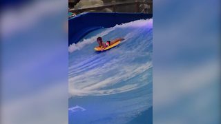 Little Girl Enjoys A Wave Pool