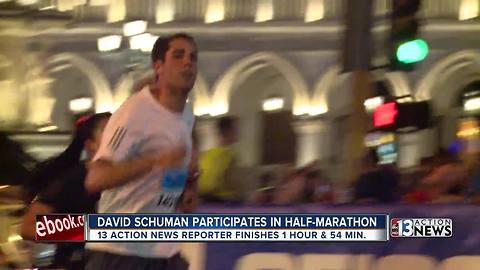 Reporter David Schuman crosses finish line