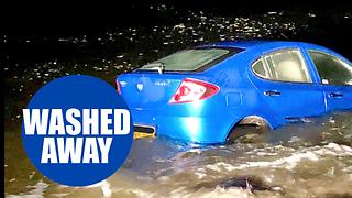 Shocking footage shows a car being washed out to sea