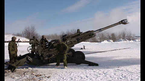 M777 Howitzers fire on top Snowy land