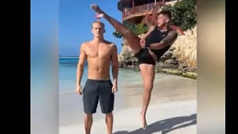 Anthony Pettis and Valerie Loureda bottle kick challenge on the beach