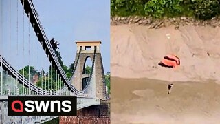 Two base jumpers seen jumping off one of Britain's most iconic bridges