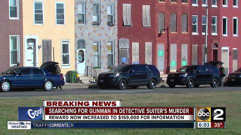 Police continue to search for gunman after Baltimore detective shot