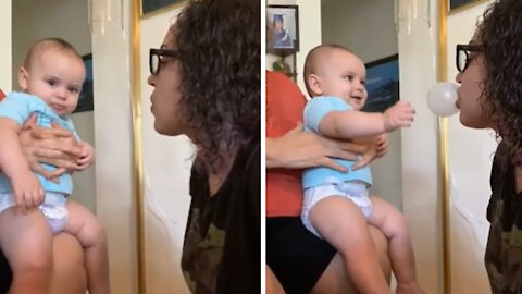 Baby Thinks Popping Bubble Gum Is The Funniest Thing Ever
